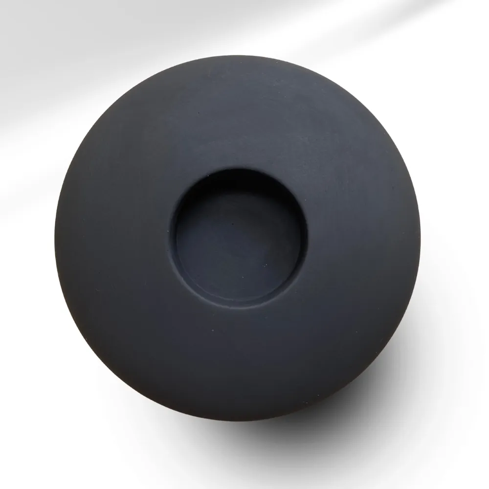 Pebble tealight holder in charcoal black – top view